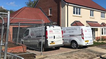 Our Company vans at a completed project